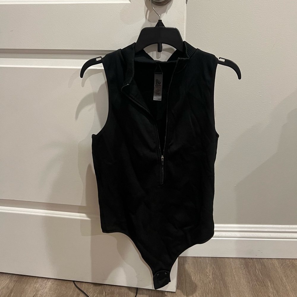 Black zip up body suit from GARAGE